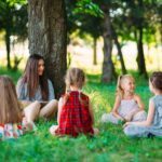 Children listening to a story in the park