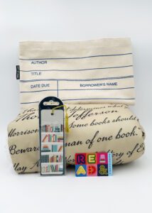 Prize bundle with book-themed fleece blanket, library card tote bag, bookshelf bookmark, and a Barnes & Noble gift card