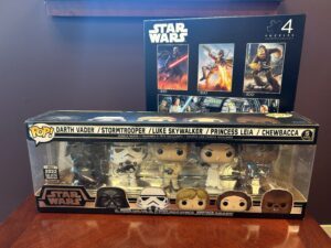 Prize bundle with a jigsaw puzzle set (4 scenes) and a Funko Pop! set with Darth Vader, Storm Trooper, Luke Skywalker, Princess Leia, and Chewbacca