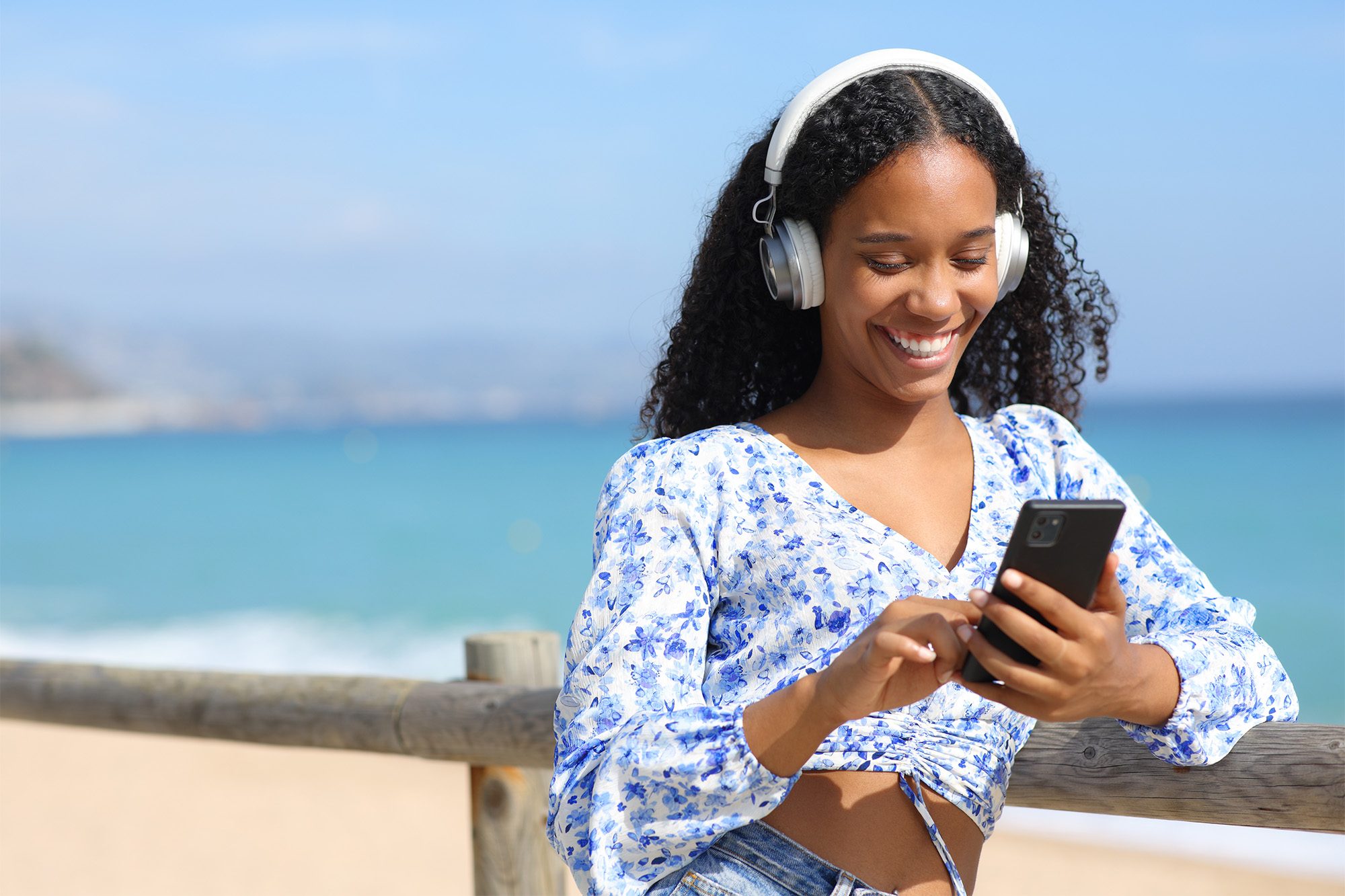 Woman listening to eAudiobook in summer