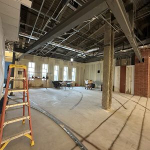 Cleared-out space for Teen Lounge with new structural steel beams overhead