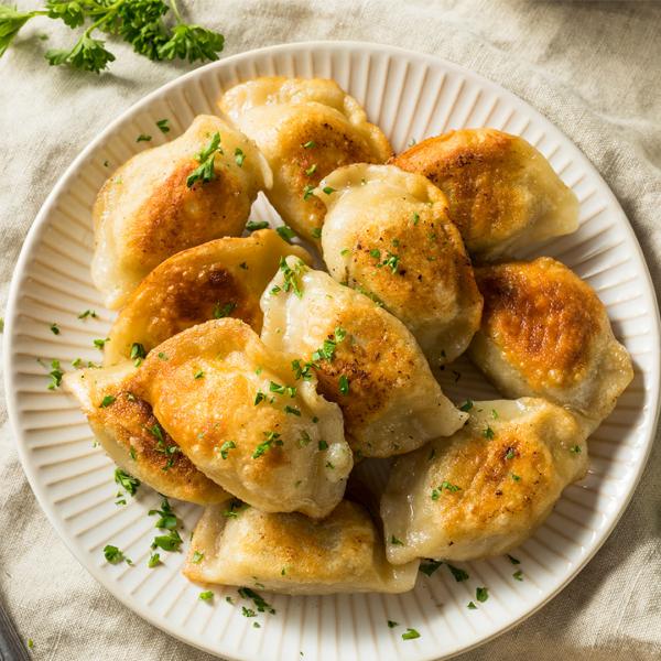 Plate of golden brown pierogis